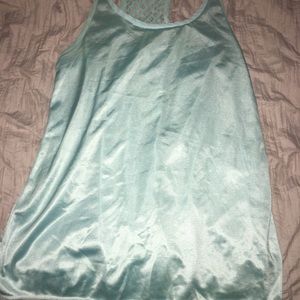 A teal shirt or a swim suit cover up